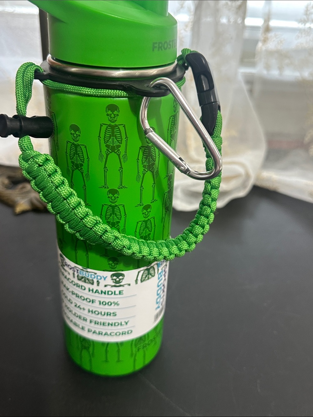 Frostbuddy green with black skeleton 24 oz water bottle